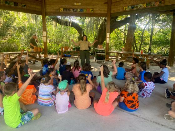 Photo submitted by Diana Drew. Putnam County children listen to a speaker at Ravine Gardens during Camp Common Ground. 