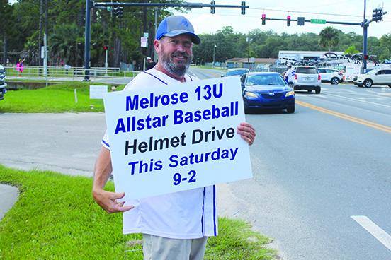 Melrose head coach Dale Yarbrough holds a sign up to promote the fundraising drive, a day before his 50th birthday. (MARK BLUMENTHAL / Palatka Daily News)