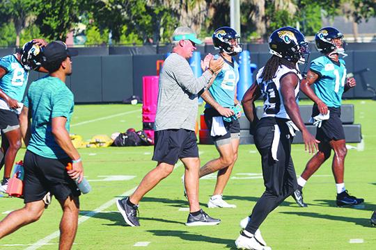 Jacksonville Jaguars head coach Doug Pederson (center) gives encouragement to his players on the first day of preseason camp at the new Miller Electric Center on Wednesday. (MARK BLUMENTHAL / Palatka Daily News)