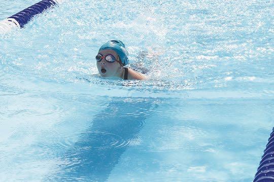 Parker Paisley Flanders swims in the girls 7-8-year-old division 25-yard freestyle during Saturday’s swim meet against Eagle Landing at the Putnam Aquatic Center. (MARK BLUMENTHAL/ Palatka Daily News)