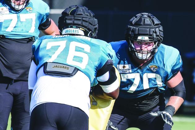 Jaguars No. 1 draft pick Anton Harrison (76) works on blocking drills with Cole Van Lanen during Monday’s practice. (JOHN STUDWELL / Special to the Daily News)
