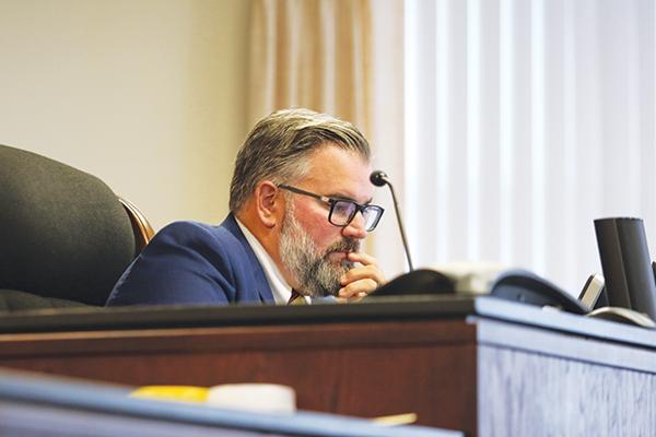 Judge Kenneth Janesk II reviews documents Tuesday during the recall hearing for Crescent City Commissioner Cynthia Burton.