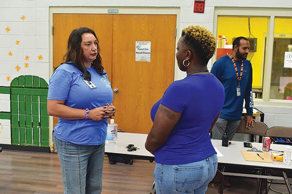 BRANDON D. OLIVER/Palatka Daily News -- Putnam County School District Administrator Sarajean McDaniel, left, talks with Browning-Pearce Elementary School Principal Yolanda Brady Tuesday shortly after the school opened as an emergency shelter.