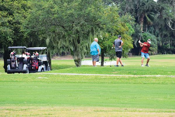 BRANDON D. OLIVER/Palatka Daily News – A group of men plays golf Wednesday afternoon at the Palatka Golf Club after it was clear the city had not sustained major damage from Hurricane Idalia.