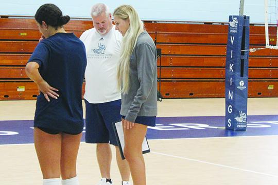 New St. Johns River State College volleyball coach Bill Bonham gets practice input from new assistant coach and former player Kirby Mason. (MARK BLUMENTHAL / Palatka Daily News)