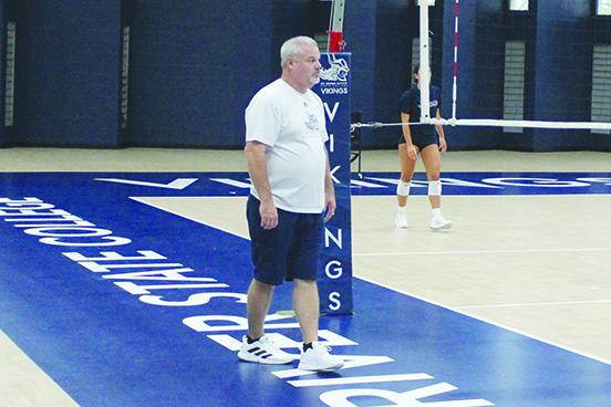 St. Johns River State College volleyball coach Bill Bonham watches his team practice Thursday inside Tuten Gymnasium. (MARK BLUMENTHAL / Palatka Daily News)