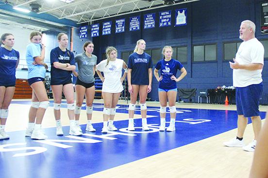 New St. Johns River State College volleyball coach Bill Bonham talks to his players after practice on Thursday at Tuten Gymnasium. (MARK BLUMENTHAL / Palatka Daily News)