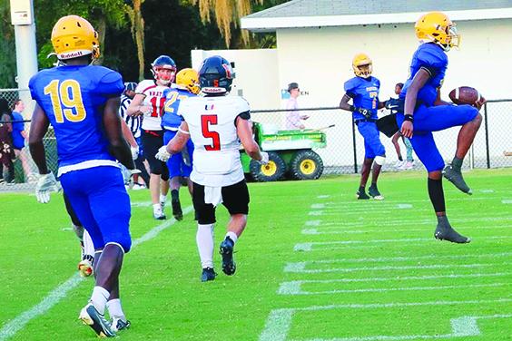 Palatka quarterback Tommy Offord (right) celebrates the first of his four touchdown runs en route to a 45-6 Panthers win over Umatilla Friday. (RITA FULLERTON / Special to the Daily News)