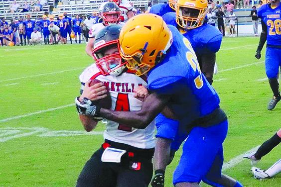 Umatilla quarterback Traighten Pope is stood up near the goal line by Palatka defender Jimmie Williams Friday night. (RITA FULLERTON / Special to the Daily News)