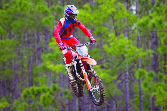 An unidentified high-flying motocross rider catches air during a session at the Bostwick Creek Motocross Park on the border of Bostwick and Green Cove Springs. (GARY ALLRED / Special to the Daily News)