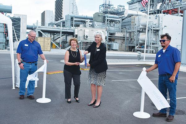 BRANDON D. OLIVER/Palatka Daily News – Susie Reeves, second from left, the president of Seminole Electric Cooperative’s board of trustees, and Lisa Johnson, second from right, Seminole's CEO and general manager, cut the ribbon to launch the Seminole Combined Cycle Facility on Wednesday.