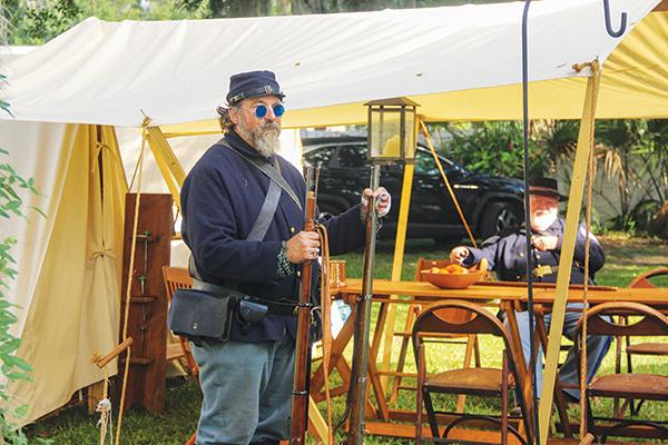 SARAH CAVACINI/Palatka Daily News – Reenactors portraying Union soldiers prepare to tell students about life in the 1860s during the Civil War.