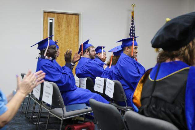 SARAH CAVACINI/Palatka Daily News. Project SEARCH graduates clap and smile Friday morning during their graduation ceremony at St. Johns River State College. 