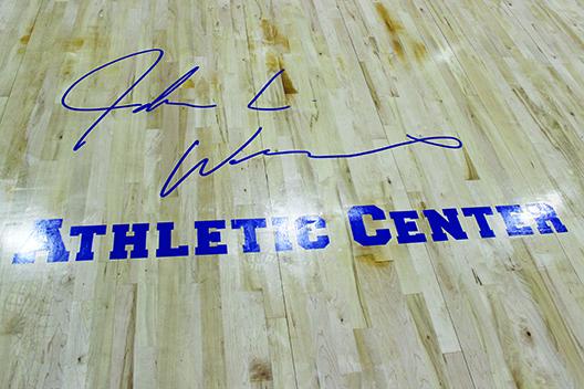 The logo of John L Williams’ signature is shown on the new court at the John L Williams Athletic Center. (MARK BLUMENTHAL / Palatka Daily News)