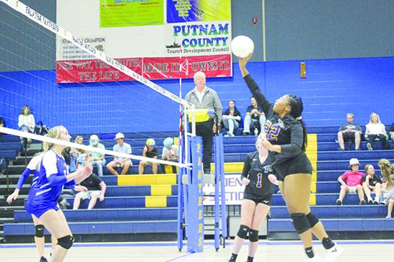 Palatka’s Tanaja Martin hits the ball over the net during the second set of Friday’s volleyball match against Peniel Baptist at the newly minted John L Williams Athletic Center. (MARK BLUMENTHAL / Palatka Daily News)