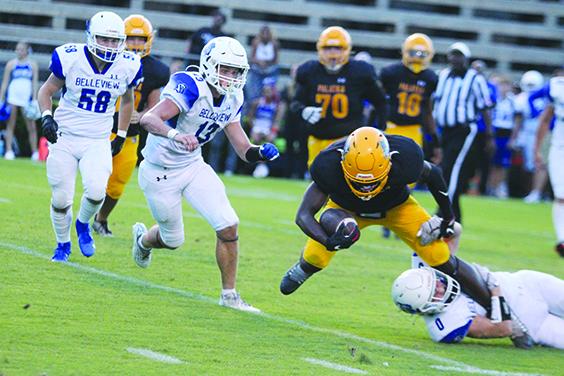 Palatka’s Trenton Williams (with ball) is stopped for no gain on a pass play by Belleview’s Braeden Roseberry. (MARK BLUMENTHAL / Palatka Daily News)