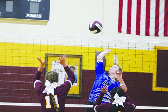 Interlachen’s Ava Mitzell delivers a kill attempt over Crescent City’s Audrah Lewis during Tuesday’s match. (MARK BLUMENTHAL / Palatka Daily News)
