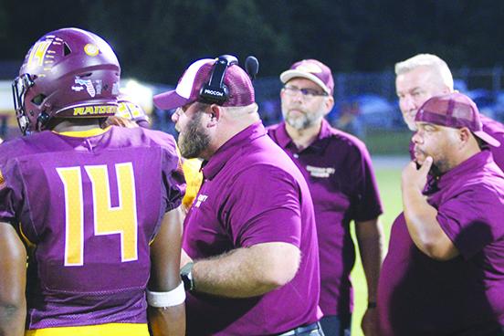 Crescent City Junior-Senior High School football coach Robert Ripley talks to his team during a timeout in last Friday’s loss at home against Hilliard. (MARK BLUMENTHAL / Palatka Daily News