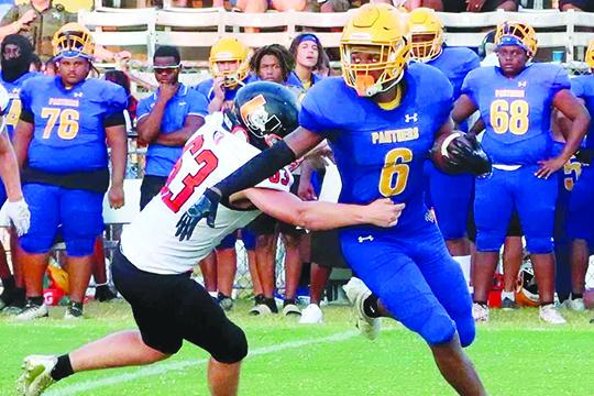 Palatka running back Justin Fells (6) looks for running room during the Panthers’ victory over Umatilla on Aug. 25 at home. (RITA FULLERTON / Special to the Daily News)