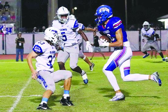 Keystone Heights wide receiver Andru Siemer (right) looks for yardage against Interlachen defenders Dakota Leach (left) and Jaquevis Nixon Friday night. (RITA FULLERTON / Special to the Daily News)