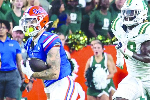 Florida receiver Ricky Pearsall races for yardage against Charlotte Saturday night in Gainesville. (JOHN STUDWELL / Special to the Daily News)