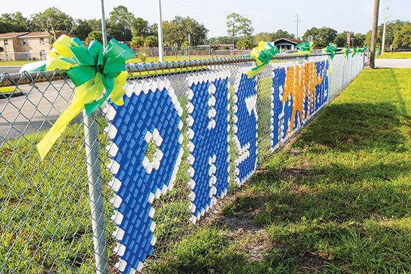 SARAH CAVACINI/Palatka Daily News – Ribbons blow in the wind Tuesday outside Palatka Junior-Senior High School to honor 16-year-old Baylee Holbrook, whose favorite color was green.