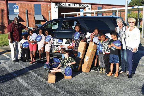 BRANDON D. OLIVER/Palatka Daily News – Local children hold pickleball equipment the St. Johns River Pickleball Group donated to the city of Palatka to create the Mobile Rec program that will take the sport to people throughout the city.