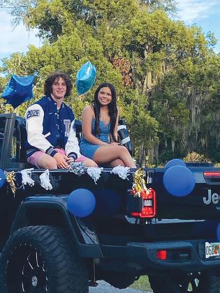 Submitted photo – Members of the Interlachen High homecoming court ride on the back of a truck during the parade in downtown Interlachen. 