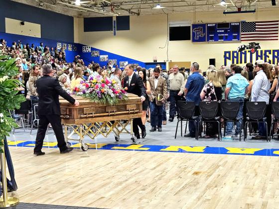 BRANDON D. OLIVER/Palatka Daily News – Baylee Holbrook's casket is led out of Palatka Junior-Senior High School, where her funeral took place Saturday afternoon.