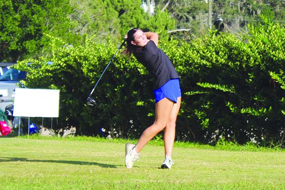 Palatka's Kaley Giddens watches her tee shot on the first hole during Monday's District 4-2A championship at the Palatka Municipal Golf Club. (MARK BLUMENTHAL / Palatka Daily News)