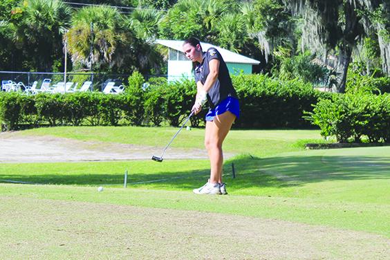 Palatka’s Kaley Giddens delivers a putt on the 18th green during Monday’s District 4-2A girls golf tournament at Palatka Municipal Golf Club. Giddens shot a team-best 91 on the day. (MARK BLUMENTHAL / Palatka Daily News)