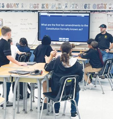 Courtesy of the Putnam County Sheriff's Office. Putnam County Sheriff's Office Sgt. Josh Lewis, the youth resource unit leader for West Putnam, teaches Kelley Smith Elementary School students recently. 