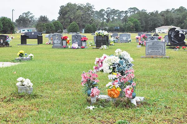 BRANDON D. OLIVER/Palatka Daily News – Flowers adorn headstones at Oak Hill West Cemetery in Palatka on Friday.