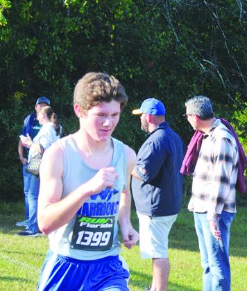 Peniel Baptist Academy's Caleb Baker comes to the finish line Thursday at Alligator Lake Park, Lake City, taking 63rd place in 19:46. (MARK BLUMENTHAL / Palatka Daily News)