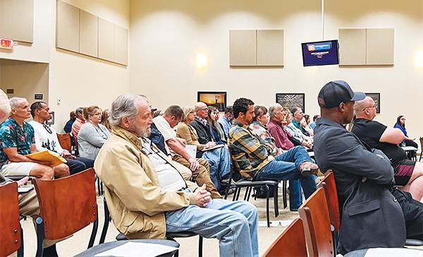 SARAH CAVACINI/Palatka Daily News – Putnam and Clay County residents listen Tuesday morning as people speak about a proposed glamping and camping venue that was later struck down.