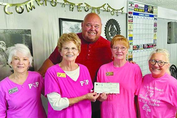 Members (from left) Ruth Harper, Dee Craft, Peggy Aninch and Sandy Garrison hold a check up for $3,313, raised for the Pink Out Putnam golf tournament. In the back is The Oaks Golf Club owner Adam Lupplace. (Submitted photo)