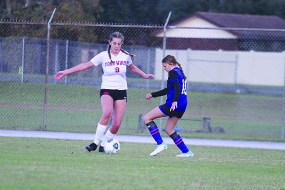 Fort White’s Madalyn Malcolm (8) controls the ball in front of Interlachen’s Kylie Frady during first-half play Wednesday. (MARK BLUMENTHAL / Palatka Daily News)