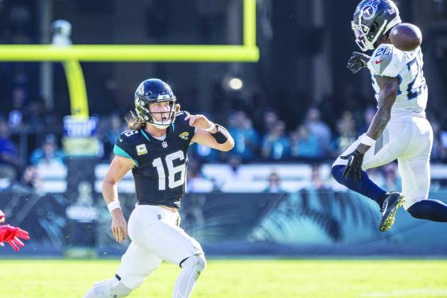 Jaguars quarterback Trevor Lawrence gets a pass off just past Titans defender Kristian Fulton in the first half of Sunday’s 34-14 victory. (JOHN STUDWELL / Special to the Daily News)
