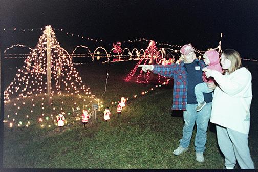 Palatka Daily News archive photo. A family looks at Putnam County Christmas decorations during the Christmas holidays in the past.
