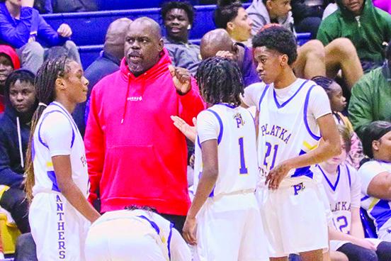 Palatka coach Craig Washington huddles his players up before going back out onto the court after a first-half timeout. (RITA FULLERTON / Special to the Daily News)