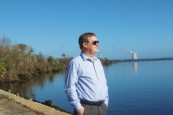 File photo – Port Manager Sam Sullivan stands at the edge of the Putnam County Barge Port in 2021.