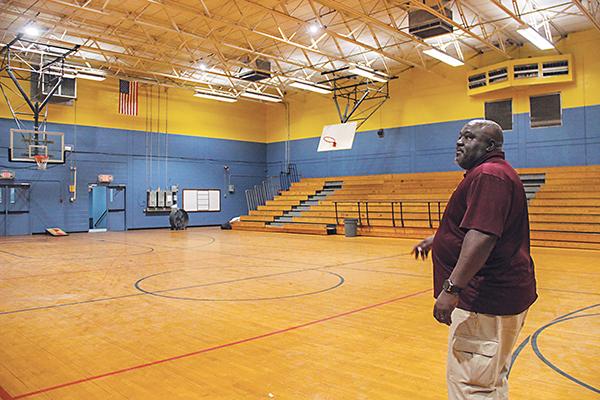 SARAH CAVACINI/Palatka Daily News – Palatka Community Affairs Director Eddie Cutwright explains what needs to be repaired in the former Jenkins Middle School gym before the facility can open as a community center.