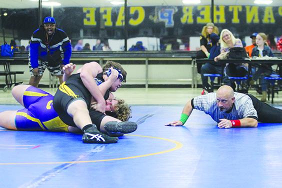 Palatka’s Ben Clark puts Union County’s Dylan Lane in pin position during the unlimited weight division match Tuesday night in the Palatka Commons. (MARK BLUMENTHAL / Palatka Daily News)