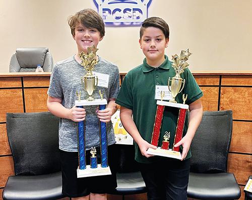 Photo courtesy of the Putnam County School District – Browning-Pearce Elementary School sixth grader Brady Pinkerton, left, and Putnam Academy of Arts & Sciences seventh grader Tristian Schultz take the top prizes at the Putnam County School District Spelling Bee.