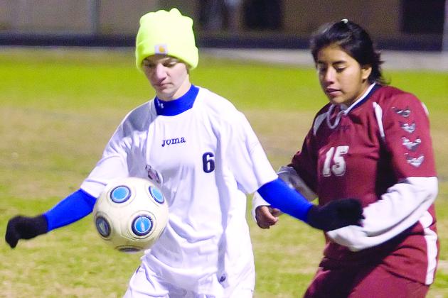 Palatka’s Loran Strunk looks to control the soccer ball against Crescent City’s Diana Dominguez during a January 2011 match. (Daily News file photo)