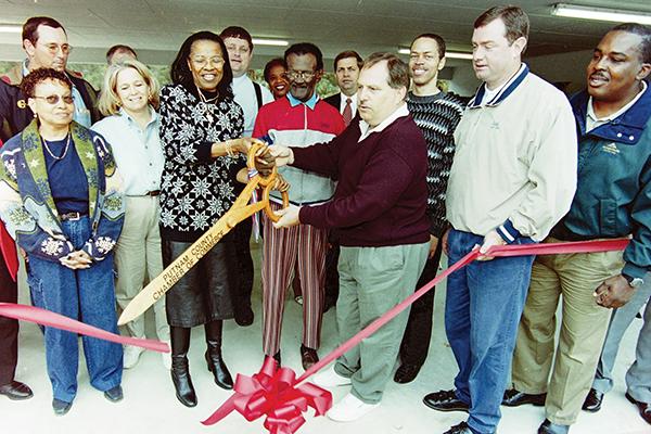 Daily News file photo – From left, former state Sen. Betty Holzendorf, Lefty Turner and former Palatka Mayor Tim Smith cut a ribbon in the 1990s to celebrate a new pavilion built at Booker Park - Lefty Turner Field.