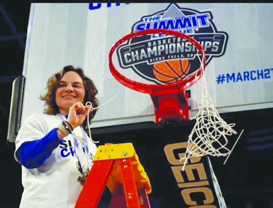 Loran Strunk takes a piece of the net last week after South Dakota State’s women’s basketball team won the Summit Tournament championship. (Submitted photo)