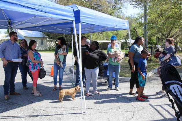 SARAH CAVACINI/Palatka Daily News. New pet owners wait for their dogs to receive their vaccinations on March 15 at the Putnam County Governmental Complex. 