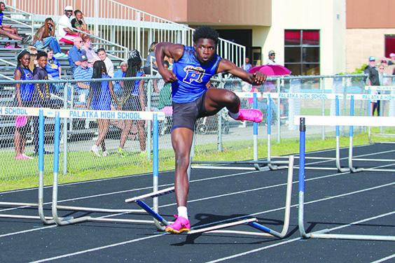 Palatka’s Tony Fields stumbles over the final hurdle Tuesday, but continues on to win the boys county championship in the 110-meter high hurdles. (MARK BLUMENTHAL / Palatka Daily News)