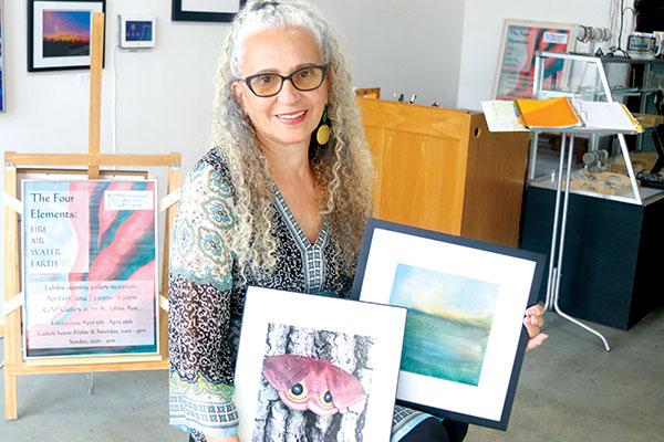 Photos by TRISHA MURPHY/Palatka Daily News – Marty Johnson shows some of her artwork that will be on display during the Gathering Artists of Putnam exhibit and opening reception Saturday in Palatka.